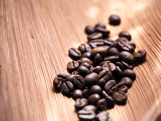 coffee beans in a bag on wooden background.