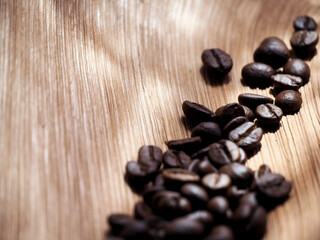 coffee beans in a bag on wooden background.