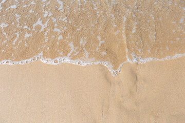 Clear water wave on the sand beach, nature concept background, summer outdoor day light