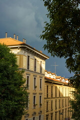 Fototapeta na wymiar Old buildings along via Piero della Francesca in Milan, Italy