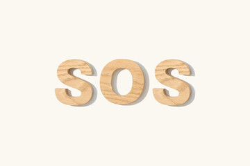 wooden text SOS