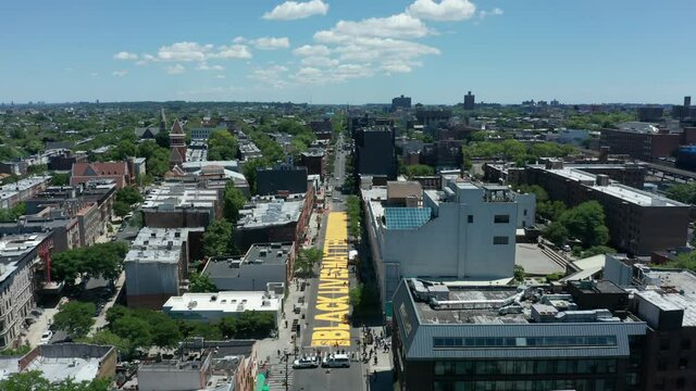 flying over and tilting down on BLM sign on Fulton St. in Bed Stuy Brooklyn