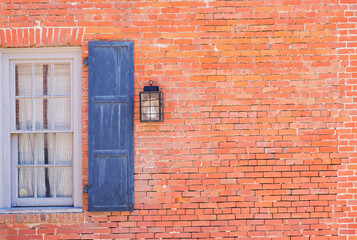 Old brick wall with blue window