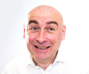 portrait of bald adult mature man with emotions on white background