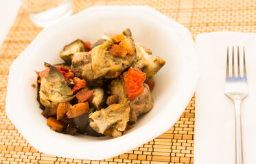 dish of vegetable stew. stewed eggplant, minced meat, carrots, peppers, onion squid