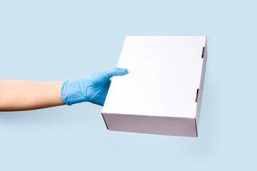 Obraz premium Safe delivery. Front view to delivery box in female hand.