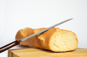 bread and knife on white background. 