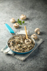 Homemade mushroom ragout with cream and parsley