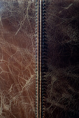 Detail of seam on worn leather material