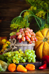 The table, decorated with vegetables and fruits. Harvest Festival. Happy Thanksgiving. Autumn background. Selective focus.