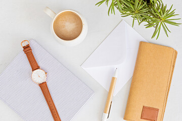 Styled minimal desktop mockup with organic color stationary, coffee cup. Freelancer, social media blogger concept. Flat lay, top view