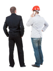 Back view of  two business man in suit with mobile phone.