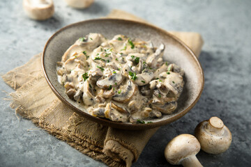 Homemade mushroom ragout with cream and parsley
