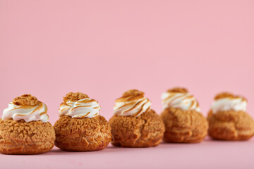 Tasty sweet cupcakes on pink background. space for text