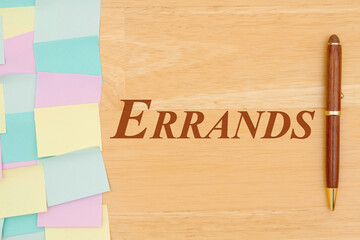 Errands type message with multi-color sticky note and a pen
