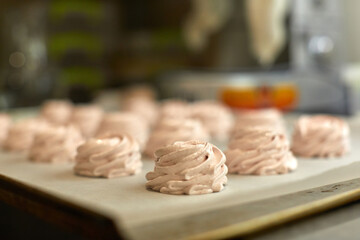 sweet meringue are ready for baking in the oven