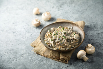 Fototapeta na wymiar Homemade mushroom ragout with cream and parsley