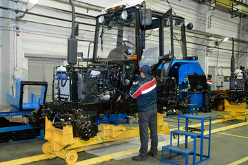 tractor Assembly on the conveyor, engine, spare parts