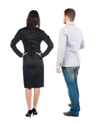 Back view of business woman and business man in suit.