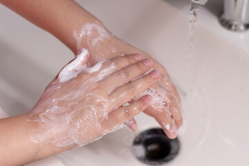 Fototapeta premium washing hands with soap