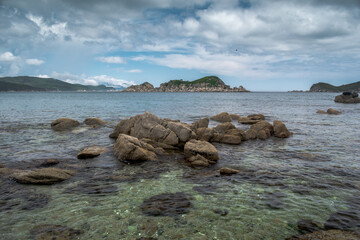 Fototapeta na wymiar Big stones in the sea near the coast