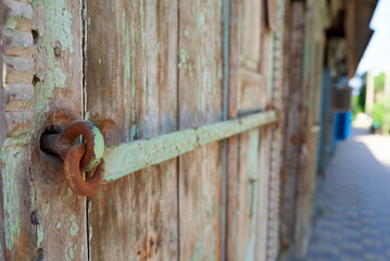 green old lock of wooden window