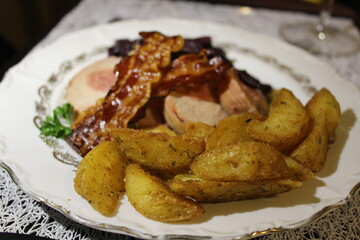 pork filet mignon with baked potatoes with fried bacon