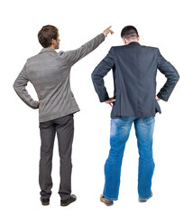 Back view of two business men in suit pointing.