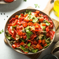 Multi-colored Italian pasta with capers and tomatoes