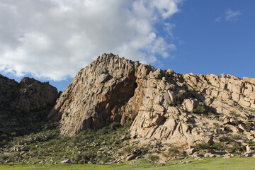 Large rocky mountains in the daytime sky