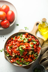 Multi-colored Italian pasta with capers and tomatoes