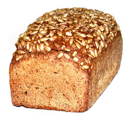 Loaf of sunflower bread with seeds on crust isolated on white background