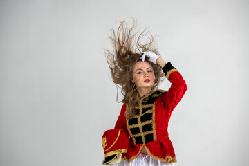 beautiful girl in red hussar uniform with loose hair