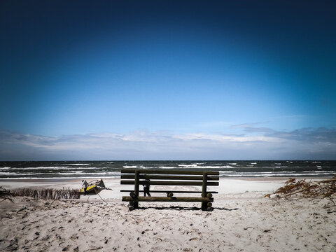Bench on beach in Stilo, Baltic Sea coast, Poland. © Jan