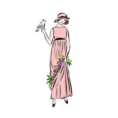 Beautiful woman dressed in pink long dress decorated with flowers and hat holds bird. 