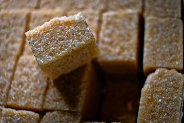 Close up shot of brown cane sugar cubes in pack