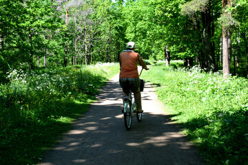 a girl rides a Bicycle