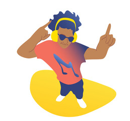 A young handsome guy in headphones is dancing to the music. The concept of dancing from top. Fresh design.
