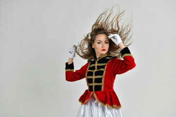 beautiful girl in red hussar uniform with loose hair