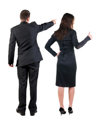 Back view of business man and business woman in suit pointing.