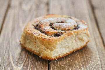Tasty buns with raisins on a brown rustic wooden table. fresh bakery. breakfast. bread. top view