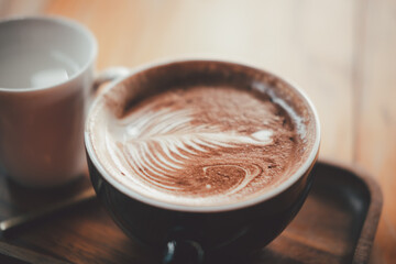Delicious hot chocolate with froth art on top in cup