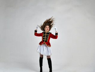 beautiful girl in red hussar uniform with loose hair