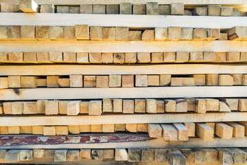 A large pile of boards sawn from trees on a sawmill for the procurement of building materials for...