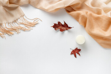Autumn composition. Cup of coffee and dried leaves on a white background. Autumnal, flat lounger, top view. Copy space