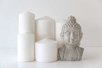 Cylinder Shaped White Candles And Buddha Figured Candle