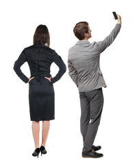 Back view of business woman and business man in suit with mobile phone.