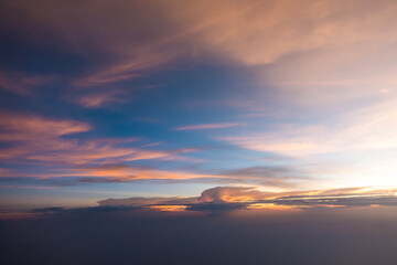 Fototapeta na wymiar Sunset sky during twilight from airplane window