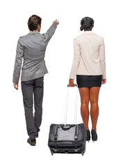 Back view of two business people in suit pointing.