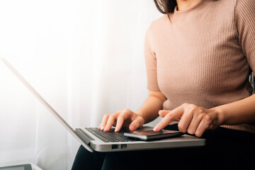 Naklejka premium Digital marketing media in virtual screen.businesswoman hand working with mobile phone and modern compute with VR icon diagram at office in morning light